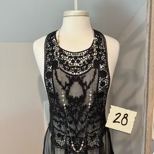 Long necklace with pearl like beads.